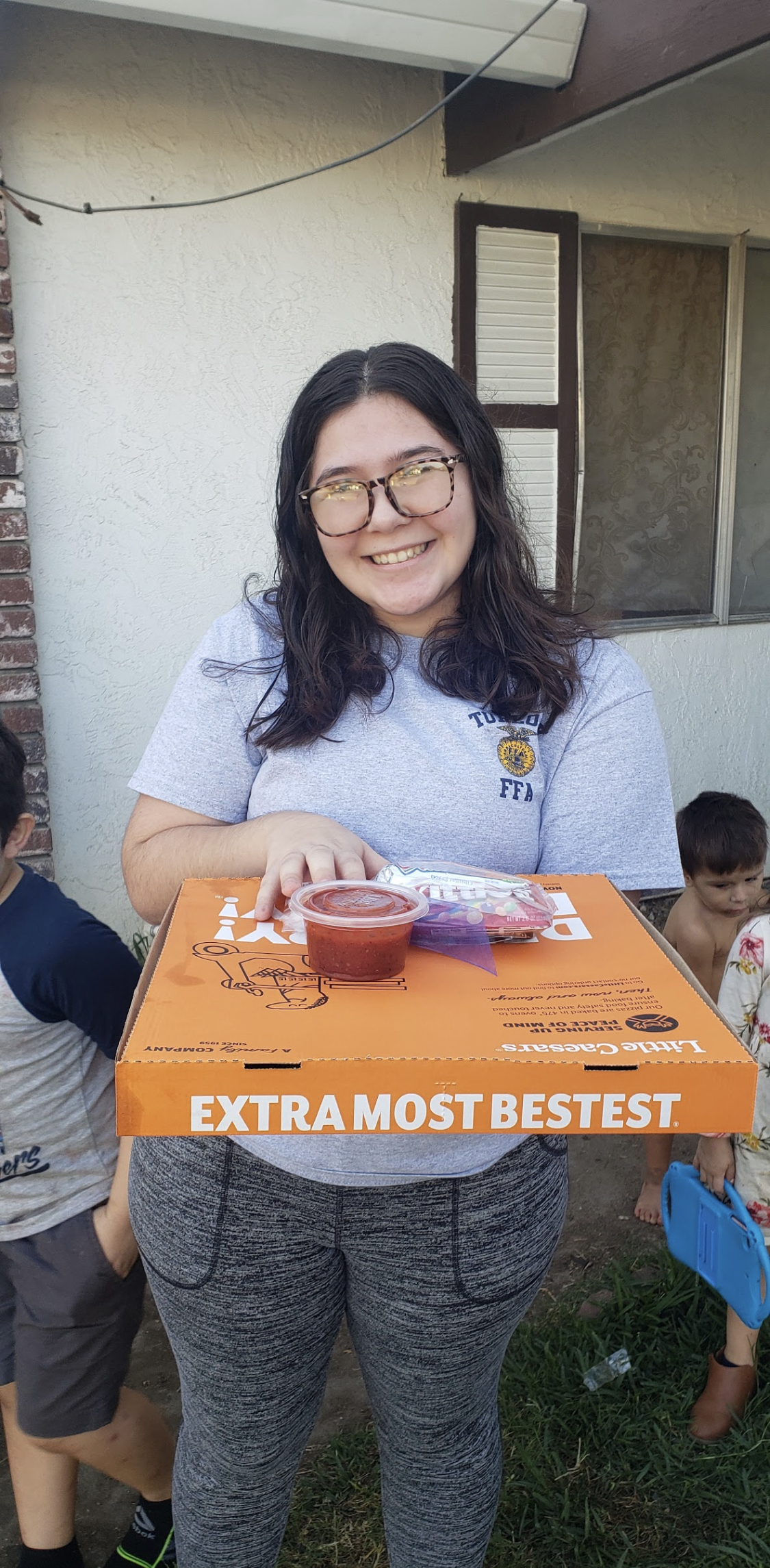 Turlock students delivering pizza to members